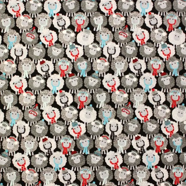 Wooly Friends, Tela con ovejas en tonos blanco y negro con detalles en rojo y turquesa 