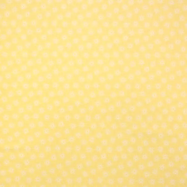 Molinillos Amarillos, Tela en color amarillo estampada con soles de color blanco