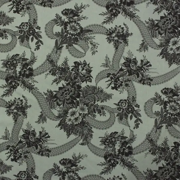 Floral Lace, Tela de Paula Barnes con fondo verde y dibujos florales en color negro 